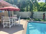 Pool Deck with Table, Chairs and Umbrella